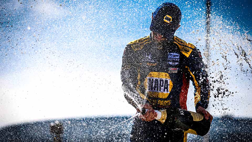 Alexander Rossi Sprays champagne at the Acura Grand Prix of Long Beach